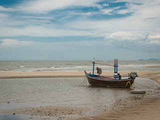 boat on the beach when low tide