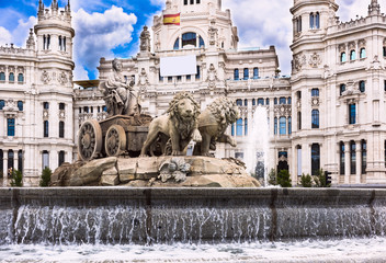 Cybele's fountain on Cybele's Square (Plaza de la Cibeles) and Central Post Office (Palacio de Comunicaciones) in Madrid, Spain