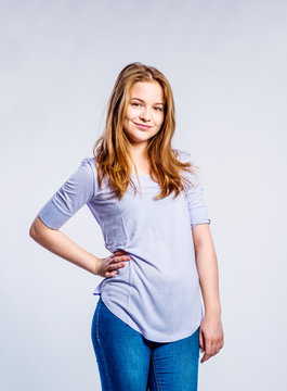 Girl in jeans and t-shirt, young woman, studio shot
