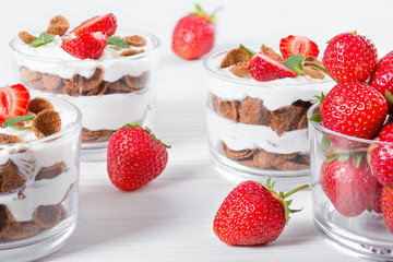 homemade yogurt in cups with whole grain flakes