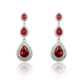 Pair of ruby diamond earrings isolated on white