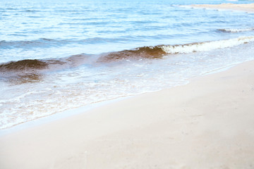 Waves. Sand. Sea. Outdoor recreation concept. Summer background.