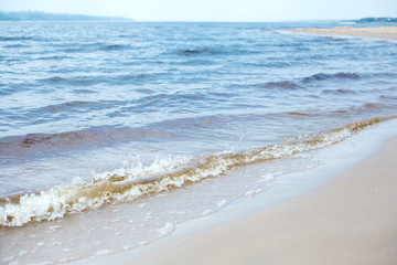 Waves. Sand. Sea. Outdoor recreation concept. Summer background.