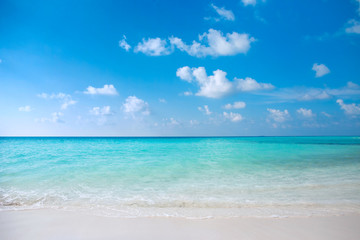 turquoise clear blue ocean water on tropical white sand beach 