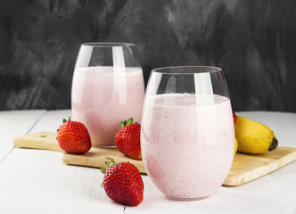 Milkshake with strawberry and banana in glasses