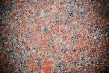 Stone Background of mottled red granite igneous rock
