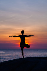 Fototapeta na wymiar Yoga at sunset time