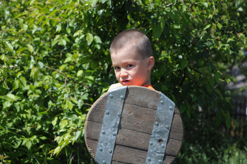 Boy playing role of young warrior