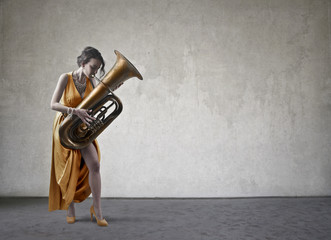 Fototapeta na wymiar Classy lady playing an instrument