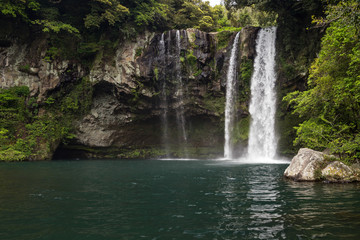 Fototapeta na wymiar Cheonjiyeon Waterfall on Jeju Island in South Korea.