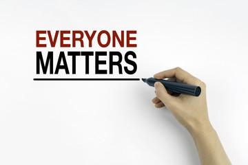 Hand with marker writing - Everyone Matters