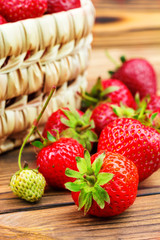 Group of ripe, organic strawberry on wooden table