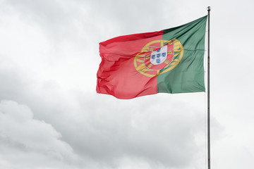 Flag of Portugal with clouds in background