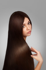 Brown Hair. Beautiful Woman with Straight  and Shiny Smooth Long  Hair.