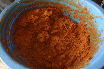 traditional home production of sausages on the island of Mallorca, Spain. Mixing of minced meat and spices for traditional Spanish Sobrasada sausages.