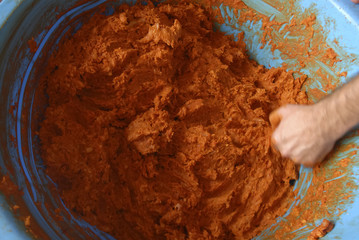 traditional home production of sausages on the island of Mallorca, Spain. Mixing of minced meat and spices for traditional Spanish Sobrasada sausages.