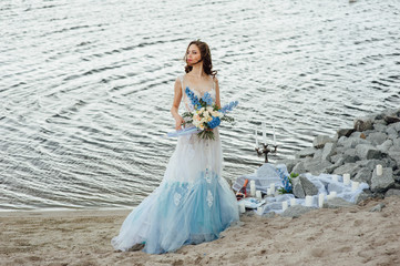 Fototapeta na wymiar Beautiful young bride in luxury wedding dress