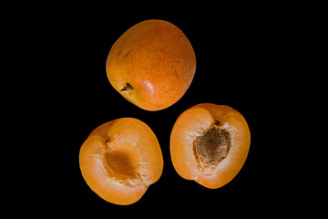 Apricot fruit isolated on black background