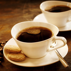 Freshly brewed cup of strong espresso coffee