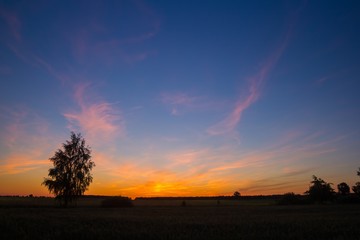 Fototapeta na wymiar Beautiful after sunset sky over fields in Poland.