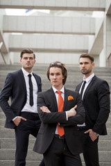 Fototapeta premium Three young men in elegant business suits