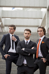 Fototapeta premium Three young men in elegant business suits