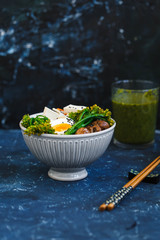 Chinese noodles stir fry with egg, vegetables served with a pair of chopsticks