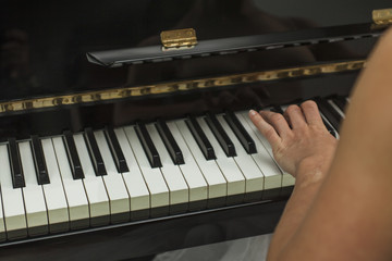 Close up ballerina hand playing the piano