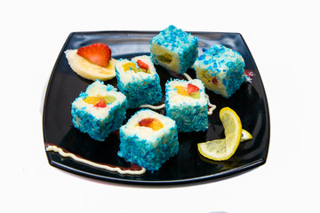 Dessert Maki Sushi - Roll with Various Fruit in rice pudding and coconut flakes