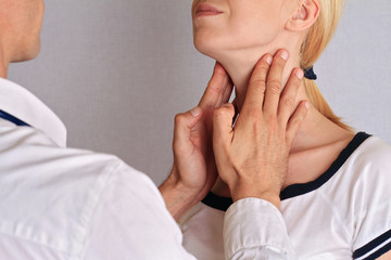 Woman getting thyroid gland control. Health care and medical concept - obrazy, fototapety, plakaty