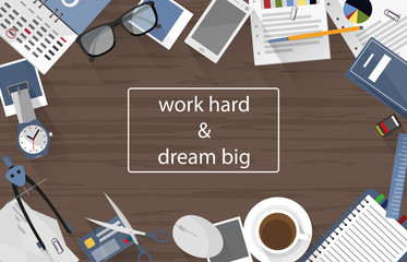 work hard and dream big written on office desk