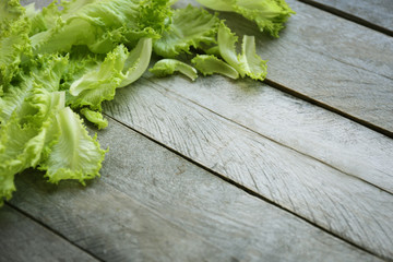 Fresh salad leaves on wooden background