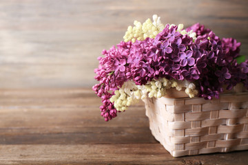 Fresh lilac on wooden background
