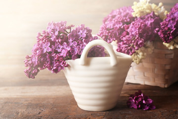 Fresh lilac on wooden background