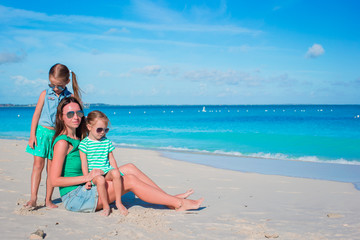 Naklejka premium Mother and daughters enjoying time at tropical beach