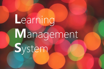 LMS (Learning Management System) acronym on colorful bokeh backgrund