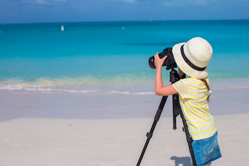 Little girl making video or photo with mobile phone