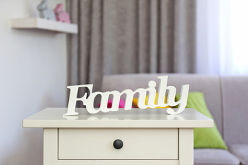 Wooden text Family in modern interior