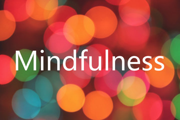 mindfulness word on colorful bokeh background