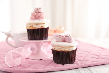 Decorative cupcakes on table