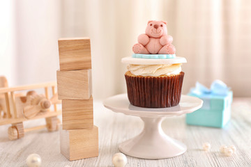 Delicious cupcake with wooden cubes
