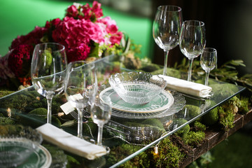 flower arrangement in bowl with pink roses and hydrangea. table setting