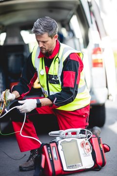 Ambulance man preparing equipment