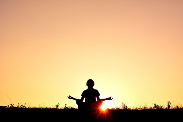 Silhouette children yoga at sky sunset