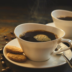 Close up of steaming coffee served in porcelain
