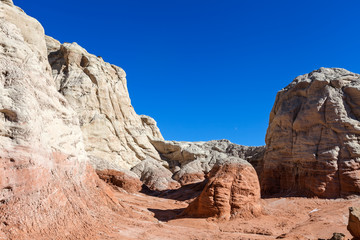 Fototapeta na wymiar Toadstool Trail-north of Page Arizona.This fantasyland of mushroom formations against white cliffs and deep blue skies, is spectacular