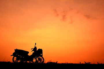 Fototapeta na wymiar Motorcycle at sky sunset