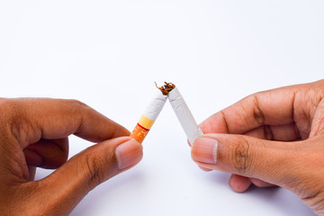 Broken cigarette in man hands,world no tobacco day concept