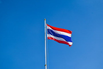 Thai flag of Thailand with blue sky background