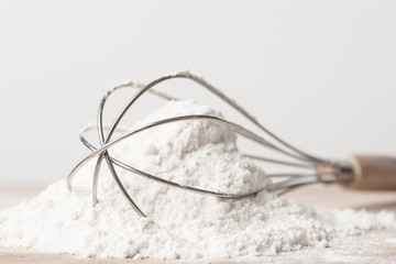 Flour and whisk prepare for cooking or baking